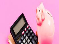 Picture of a calculator and a piggy bank